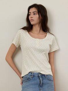 This is a trendy and feminine top by Q’SRB that is made out of high quality and sturdy material. With distinctive mood of the design and modern feminine look, you can style it for your casual daily outfit.- Minimal printing detail on the fabric- Three button detail on the front- Casual and trendy look Relaxed Fit Button T-shirt For Everyday, Trendy Spring T-shirt With Buttons, Trendy Spring T-shirt With Button Closure, Crew Neck Cotton Blouse With Button Closure, Fitted Spring T-shirt With Button Closure, Spring Relaxed Fit T-shirt With Buttons, Fitted Casual T-shirt With Button Closure, Trendy Short Sleeve Top For Casual Gatherings, Trendy Summer T-shirt With Button Closure