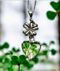 Get your green on with this pretty St.Patrick's Day necklace. You can also wear it year round. The pendant was made from Aynsley Shamrock broken china and recycled into a pendant. The pendant was decoratively soldered with a lead free silver alloy and suspended from a sterling silver four leaf clover centerpiece that was pressed in a potter impression die and a sterling silver bail that is connected by sterling silver jump rings.  You have the option of choosing the pendant only, a ready made 1.3mm cable sterling silver chain with a small lobster clasp, or a 2.3mm sterling silver oval long and short chain with clear crystals that I wrapped with sterling silver wire and a sterling silver heart lobster clasp. I have attached a picture of the two sterling silver chains you can choose from. Th Handmade Green Jewelry For Valentine's Day, Green Flower Pendant Necklace For Anniversary, Green Heart Charm Jewelry For Anniversary, Green Handmade Necklace For Anniversary, Green Heart Necklace For Gift, Green Sterling Silver Jewelry For Valentine's Day, Handmade Green Necklace For Anniversary, Green Necklace With Heart Charm For Anniversary, Green Charm Necklace For Anniversary