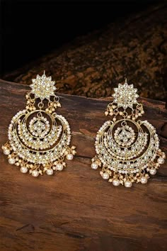 I Jewels Women's/Girls 18K Gold Plated Metal Alloy Traditional Handcrafted Beaded Big Chandbali Earrings (E7077W, White) This Earring set is crafted in gold plated finish with stunning antique finish - these earrings are really special .The Earrings feature Kundan-studded.Be stylish and smart with these Golden Earring. Perfectly crafted. Wear it with a suit or a saree, and lehenga for an ethnic yet classy look. This earring set is a great option and a perfect pick for your wedding functions. Be Sabyasachi Earrings, Jewellery Shoot, Jhumka Designs, Heavy Earrings, Chandbali Earrings, Traditional Earrings, Kundan Earrings, Boutique Collection, Indian Wedding Jewelry