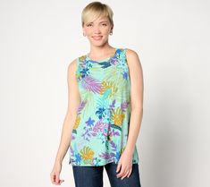 Sunny summer days call for cool and carefree clothing, like this pretty printed tank top. Covered in a fabulous floral design, it's the piece you'll keep coming back to throughout the season. From LOGO by Lori Goldstein®. Vacation Multicolor Relaxed Fit Tops, Vacation Relaxed Fit Multicolor Tops, Spring Tropical Print Tops With Relaxed Fit, Spring Tropical Print Relaxed Fit Tops, Casual Floral Print Top For Beach Season, Spring Green Relaxed Fit Tank Top, Spring Tropical Print Sleeveless Tank Top, Sleeveless Tank Top With Tropical Print For Spring, Sleeveless Tropical Print Tank Top For Spring