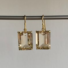 The glistening champagne tones in these opulent citrines will make every day a soirée. 18k gold setting, 14k gold ear wiresCitrines 13mm x 16mm (1/2" x 5/8")Earrings hang 1 1/8" from the ear Each earring weighs 3.3g Citrine Earrings, Design Movements, Emerald Cut, Citrine, Champagne, Emerald, 18k Gold, Modern Design, Fine Jewelry