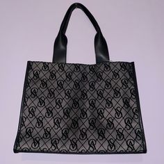 Top Snaps Together. Strap Drop Length: 10” Dimensions: 16.25" X 4.5" X 13" Brand New Victoria Secret Tote Vs Monogram, Velvet Design, Monogram Tote, Velvet Lace, Black Tote, Womens Tote Bags, Victoria Secret, Victoria’s Secret, Victoria's Secret