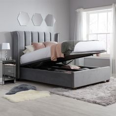 a bed that is sitting in the middle of a room