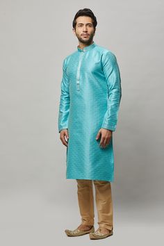 Brocade self embossed kurta with minimal gold embroidery on the placket and contrasting churidar Crafted with a collar neckline, full sleeves, and front hook closure. Occasion: Can be worn to lighter events like Mehendi, Puja, or a small party WASH CARE INSTRUCTIONS - Please Dry clean only when it is applicable. Slight color variation is possible due to digital photography. Semi-formal Long Sleeve Traditional Wear For Eid, Traditional Chikankari Embroidered Kurta For Semi-formal Occasions, Semi-formal Long Sleeve Kurta With Dabka Detail, Semi-formal Long Sleeve Kurta With Dabka, Semi-formal Long Sleeve Kurta For Eid, Semi-formal Long Sleeve Dabka Kurta, Semi-formal Long Sleeve Kurta For Diwali, Fitted Long Sleeve Churidar With Embroidered Border, Formal Straight Kurta With Embroidered Border