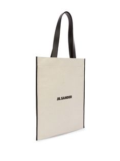 beige black cotton blend rectangle shape two leather top handles internal leather pocket internal note compartments cotton linen canvas logo print to the front This item is in size UNI and the color is Jil Sander Bag, Shopping Online Logo, Medium Tote Bag, White Tote Bag, Leather Pocket, White Tote, Bags Logo, Linen Canvas, Designer Products