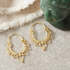 A lovely elegant and romantic style of Boho filigree gold hoops. The family I use for all my filigree jewellery have honed their skills for centuries in the far North of Thailand, Chang Mai region.  Super light weight and easy to wear, these can be matched with anything in your wardrobe for any occasion.  Sterling silver and 18k gold. All the materials I use are real Sterling Silver and 18 carat gold. I do not use inferior metals such as Gold fill or Brass Gold plated! A lovely all year round piece for yourself or a loved one! These earrings measure 3.2 cm in length. There are many handmade filigree earrings on my Etsy page, take a peek with the links below! Each item comes with a satin pouch. I can also present them in a gift box with tissue wrapping. Please select this option at the chec Brass Filigree Hoop Earrings For Wedding, Bohemian Yellow Gold Jewelry With Intricate Design, Bohemian Hoop Earrings With Intricate Design For Wedding, Bohemian Intricate Design Hoop Earrings For Wedding, Bohemian Wedding Hoop Earrings With Intricate Design, Ornate Gold Hoop Earrings For Festivals, Hoop Filigree Jewelry For Festivals, Yellow Gold Brass Hoop Earrings With Intricate Design, Gold Filigree Hoop Earrings For Weddings