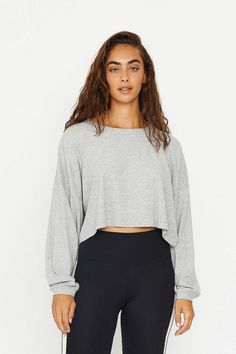 Product Details A statement oversized long-sleeve crop top, crafted from exceptionally soft small-ribbed modal fabric. This trendy piece features slouchy long sleeves, a casual crew neck, drop shoulder, and an oversized fit. Small contrasting logo on the chest. Ideal for effortless off-duty layering or wearing solo. Materials & Care Composition: 92% Modal, 8% Spandex Machine wash cold with like colors, do not bleach. wash inside out. Do not dry clean. Model is wearing size S. For more info pleas Spring Athleisure Long Sleeve Top, Solid Long Sleeve Crop Top For Loungewear, Solid Color Long Sleeve Crop Top For Loungewear, Gray Long Sleeve Crop Top For Fall, Long Sleeve Crop Top With Thumbholes For Fall, Casual Solid Crop Top With Thumbholes, Trendy Long Sleeve Crop Top For Loungewear, Cropped Tops With Thumbholes For Loungewear, Oversized Ribbed Cropped Sweater