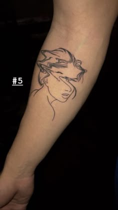 a woman's arm with a tattoo on it