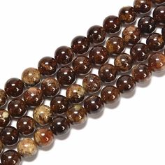 three strands of brown and white beads