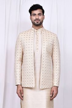 Cream jacket featuring geometric thread embroidery. Paired with a matching kurta and pant made from art silk., Fit: Relaxed Festive Long Sleeve Sets With Geometric Embroidery, Traditional Bandhgala With Geometric Embroidery For Eid, Festive Bandhgala With Geometric Embroidery For Eid, Festive Eid Bandhgala With Geometric Embroidery, Geometric Embroidery Long Sleeve Diwali Sets, Festive Sherwani With Geometric Embroidery, Festive Designer Sets With Geometric Embroidery, Festive Sherwani With Geometric Embroidery And Long Sleeves, Festive Long Sleeve Sherwani With Geometric Embroidery