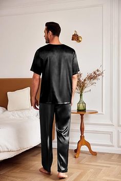 Experience ultimate luxury and comfort with our Men's Satin Silk Shirt & Pants Pajamas. Made from high-quality satin silk, this set will keep you cool and stylish all night long. The shirt features a classic button-up design and the pants have an elastic waistband for the perfect fit. Unwind in style with this must-have sleepwear set! Synthetic Fibre,soft,lightweight,fashionable.Not see through! 2 piece pajamas set includes short sleeve night shirt and long bottom.Button down pajamas are round n Satin Sleep Sets With Relaxed Fit, Relaxed Fit Satin Loungewear Sets, Satin Loungewear Set With Relaxed Fit, Satin Sets For Pajama Party With Relaxed Fit, Casual Satin Sleep Sets, Black Satin Loungewear Sets, Solid Satin Finish Sleepwear For Loungewear, Black Satin Sets For Night, Black Satin Nightwear Sets