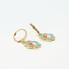 Classic, delicate earrings that lend a nostalgic yet whimsical vibe. Color: Teal, Orange, White, Gold Material: Alloy Dimensions: 1.25"L Overall, 0.5" Pendant Diameter Teal Earrings, Teal Orange, Delicate Earrings, Orange White, Gold Material, Pastel, White Gold, Orange, Pendant