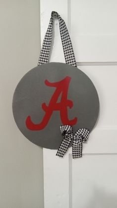 a door hanger with the letter a on it