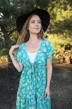 The Meadow Dress is one of my easiest to wear dresses. It has small sleeves and a full flowy maxi length. There is a deep V neck, which you can pair with a T-shirt, bandeau bra, lacy bralette, or even a bathing suit underneath... according to your mood! A tie around the waist can make this form fitting - or if you choose, you can wear open and flowy. YES - it has pockets. This item is ONE of a kind. You are purchasing the exact dress pictured. Lightweight, doesn’t wrinkle and folds up tiny… perfect for travel! It comes with its own matching set: boho headband, scrunchie and mask. Items are as close to matching as possible with fabric available. All my dresses are made with recycled fabrics. Every item is ONE of a kind. Meadow Dress, Fire Goddess, Yves Klein Blue, Boho Robes, Mumu Dress, Goddess Dress, Bandeau Bra, Boho Headband, Boho Kimono