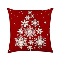 a red pillow with white snowflakes on the front and bottom, sitting against a white background