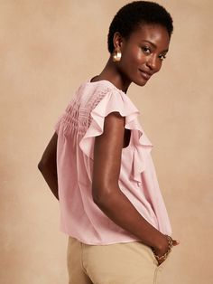 Soft with delicate pintucks, our lightweight ruffle-sleeve top is semi-sheer and made from 100% cotton for luxurious summer-day charm.  SWING FIT: Cut for a flowing, A-line fit.  No waist definition.  Crew neck with button-keyhole at back.  Straight Feminine Flutter Sleeve Tops For Day Out, Summer Butterfly Sleeve Top With Ruffle Hem, Spring Blouse With Ruffle Hem And Butterfly Sleeves, Feminine Top With Smocked Back And Flutter Sleeves, Chic Summer Tops With Flutter Sleeves, Flutter Sleeve Tops With Smocked Back For Spring, Spring Ruffle Blouse With Flutter Sleeves, Spring Tops With Smocked Back And Flutter Sleeve, Feminine Spring Blouse With Butterfly Sleeves