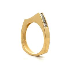 Add a modern twist to your style with this unique stacking ring. This ring features a sleek, asymmetrical design with a row of sparkling princess cut diamonds set in a channel. The diamonds have a total weight of .70 carats and have a VS1 clarity and an H color grade. Crafted in 18 karat yellow gold, the ring offers a vibrant contrast that enhances the diamond's brilliance. The peak-shaped design adds a distinctive touch, making this ring perfect for stacking or wearing alone. Whether you're dressing up for a special occasion or adding some shine to your everyday look, this channel set diamond ring is a stylish and elegant choice. Modern Channel Set Diamond Promise Ring, Modern Stackable Rings With Tension Setting For Anniversary, Modern Diamond Stackable Rings With Tension Setting, Modern Emerald Cut Stackable Rings For Formal Occasions, Modern Stackable Diamond Rings With Tension Setting, Modern Channel Set Diamond Ring, Modern Princess Cut Single Diamond Jewelry, Modern Stackable Rings With Tension Setting, Modern Formal Stackable Channel Set Rings