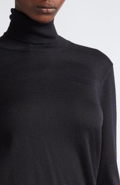 Tom Ford's tasteful elegance pervades this trim turtleneck sweater knit in Italy from silk-softened cashmere with finely ribbed trim. 23 1/2" length (size Medium) Turtleneck Long sleeves Ribbed cuffs and hem 70% cashmere, 30% silk Dry clean Made in Italy Designer Clothing Black Merino Wool Turtleneck Top, Formal Black Fine Knit Sweater, High Neck Fine Knit Merino Wool Sweater, Elegant Funnel Neck Turtleneck, Elegant High Neck Turtleneck For Fall, Elegant Cashmere Sweater With Funnel Neck, High Neck Fine Knit Merino Wool Turtleneck, Elegant Long Sleeve Wool Turtleneck, Elegant Fine Knit Turtleneck For Layering