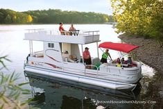 people are riding on the back of a house boat