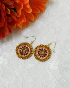 Red Round Beaded Earrings For Festive Occasions, Red Colorful Beads Hoop Earrings, Nickel-free Round Beaded Earrings For Festival, Red Hoop Earrings With Colorful Beads, Red Beaded Round Hoop Earrings, Festive Earrings With Colorful Beads, Multicolor Festive Round Hoop Earrings, Festive Round Earrings With Colorful Beads, Circular Beaded Earrings With Ear Wire For Gifts