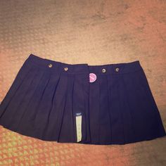 Navy Blue Pleated Skirts With Shorts Underneath. Elastic Waist On The Back. New But Only One Has The Tag Attach. Never Worn. Preppy Mini Length School Bottoms, Cute Mini Length Skort For School, Cute Mini Skort For School, Cute Cotton Skort For School, School Uniform Skort In Mini Length, Cotton School Uniform Tennis Skirt, Cute Skirted Skort For School, Cotton Mini Skort For School, Preppy School Skirt Bottoms