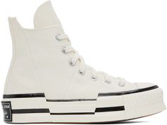 High-top paneled canvas sneakers in off-white. · Round rubber cap toe · Lace-up closure · Eyelet vents and logo patch at inner side · OrthoLite™ cushioned insole · Rubberized logo patch at rubber platform midsole · Treaded rubber outsole · Platform: H1.5 in Supplier color: Egret/Black/Egret Chuck 70 Plus, Converse Off White, Converse 70, Off White Converse, White Chucks, Converse High Top, Fall Must Haves, White High Tops, Top Sneakers Women