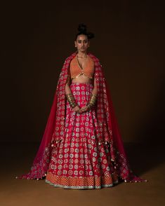 ANARDANA LEHNGA : this lehnga is made in a plush summer silk with 12 kind of flowers printed all over the base, placed in a geometric manner, and is bound with an intricate geometric border. Its hand embroidered in small mirror and sequin embroidery . The blouse is printed in small geometric pattern, then embridered with square shape sequin . Ombre Dupatta is printed and embroidered on borders and has metal coin hanging detail. Fabric : summer silk and organza fuchia -red ombre Color 15 DAYS Del Small Geometric Pattern, Ombre Dupatta, Shirt Jacket Men, Red Lehenga, Small Mirror, Geometric Border, Indian Lehenga, Red Ombre, Sequin Embroidery