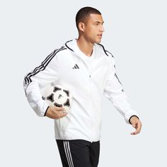 adidas Tiro 23 Men's League Windbreaker Born for the beautiful game. When the weather shows no intention of playing ball, zip up this adidas football windbreaker. Part of the Tiro 23 League range, it'll shrug off light showers and breezy conditions thanks to its woven, water-repellent shell. Its slim fit means you can pull it on over your jersey without sacrificing mobility. AEROREADY ensures you'll stay comfortable while it's on.Made with 100% recycled materials, this product represents just one of our solutions to help end plastic waste. Slim fit Full zip with lined hood 100% recycled polyester plain weave Mesh lining AEROREADY Side seam zip pockets Elastic cuffs and hem The Beautiful Game, Adidas Football, Play Ball, Plastic Waste, Nike Zoom, Adidas Men, Water Repellent, Under Armour, Slim Fit