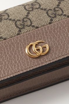 Gucci's wallet is ideally sized to slip into a clutch or coat pocket. Made from textured-leather and the house's iconic coated-canvas, it's decorated with a gold logo plaque and opens to reveal six card slots, a bill compartment and a zipped pocket. Wallet Gucci, Canvas Wallet, Gucci Gg Marmont, Coat Pocket, Print Coat, Gg Marmont, Antique Roses, Fine Watches, Brown Coat