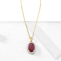 Ross-Simons - 6.30ct Ruby, .14ct t. w. Diamond Pendant Necklace in Gold. 16". Dress to impress. On a grand scale, this pendant necklace boasts a 6.30 carat oval ruby in a .14 ct. t. w. round brilliant-cut diamond halo. Suspends from a 14kt yellow gold rope chain with 2" extender and a lobster clasp. Diamond and ruby pendant necklace. Ruby birthstones are the perfect gift for July birthdays. Fine Jewelry Ruby Diamond Necklace Brilliant Cut, Oval Pendant Jewelry With Pave Setting Gift, Formal Ruby Diamond Necklace With Brilliant Cut, Ruby Necklace With Diamond Accents For Formal Occasions, Formal Ruby Necklace With Diamond Accents, Dazzling Oval Necklace With Pave Setting, Gold Ruby Jewelry With Pave Setting, Diamond Gemstone Round Pendant Necklace, Classic Oval Necklace With Pave Setting