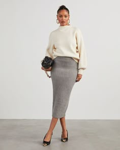 A seasonal fave, the Marciana Knit Midi Skirt is composed of thick, stretchy ribbed knit with an elastic waistband. It accentuates a body-hugging silhouette and hits just below the knee – perfect for showing off boots and heels. Elastic waistband Midi length Thick, stretchy ribbed knit No closures or lining 39% Polyester 18% Acrylic 12% Polyester 11% Wool 10% Rayon 5% Polyester 5% Nylon Casual Maxi Skirt Outfits, Knit Midi Skirt Outfit Fall, Knit Long Skirt Outfit, Rib Skirt Outfit, Grey Knit Skirt Outfit, Grey Wool Skirt Outfit, Knitted Skirt Outfit Winter, Pencil Skirt With Sweater, Long Knitted Skirt Outfit