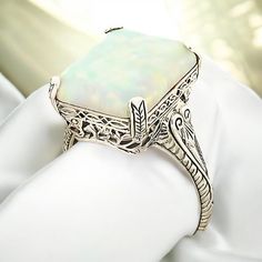 Vintage Estate 3.00 Carat Lab Created Opal Solitaire Filigree Ring. 925 Solid Sterling Silver. The Top Of The Ring Measures Just Over 1/2 Inch In Length. Set With One 14.5 x 12mm Lab Created Approx. 3.00 Carat Opal Stone. Stamped 925.  Excellent Condition/Like New. Antique White Opal Ring For Formal Occasions, Vintage White Opal Ring For Formal Occasions, Formal Silver Engraved Ring With Gemstone, Silver Engraved Ring With Gemstone For Formal Occasions, Vintage Silver Opal Ring For Wedding, Elegant Silver Engraved Ring With Gemstone, White Carved Ring For Anniversary, Vintage White Gold Opal Wedding Ring, Vintage White Gold Opal Ring For Formal Occasions