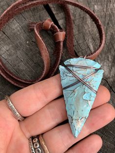 "This is my fresh spin on a wire wrapped classic. Arrowheads have been worn as jewelry for ages and are a recognizable symbol of alertness, walking the straight and narrow & strength. The arrowhead I used is made of jasper stone and is a hand knapped modern replica. It was made in the same tradition and with the same primitive techniques that early man used. I added a lovely pale turquoise & gold highlight patina then wire wrapped it with blackened (oxidized) copper wire. This is a great Adjustable Southwestern Hand Wrapped Jewelry, Southwestern Adjustable Hand Wrapped Jewelry, Southwestern Hand Wrapped Adjustable Jewelry, Adjustable Southwestern Style Hand Wrapped Jewelry, Artisan Necklace With Adjustable Patina, Adjustable Southwestern Turquoise Pendant Necklace, Adjustable Turquoise Necklace With Patina, Southwestern Style Jewelry With Patina As A Gift, Artisan Adjustable Turquoise Necklace Nickel Free