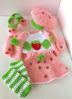 a crocheted baby outfit and booties is shown