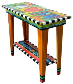 a wooden table with an artistic design on it's top and bottom shelf is painted multicolored