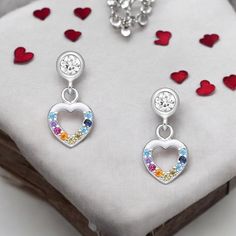 Elevate your elegance with 925 Sterling Silver Heart Earrings, adorned with vibrant CZ diamonds. New arrivals boosting any look effortlessly. Width: 1/4 inches Height: 1/2 inches Silver Heart Charm Earrings For Anniversary, Silver Earrings With Heart Charm For Anniversary, Heart Cut Sparkling Stones Earrings As Gift, Cubic Zirconia Earrings With Heart Charm For Gift, Multicolor Cubic Zirconia Earrings For Anniversary, Gift Cubic Zirconia Pierced Heart Earrings, Multicolor Cubic Zirconia Anniversary Earrings, Multicolor Sterling Silver Earrings For Anniversary, Silver Heart Earrings With Sparkling Stones For Anniversary