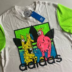 Brand New With Tags! Please Revise All Measurements Carefully! Details: - Lightweight - Graphic Print On Chest - Body Of Shirts Has Cotton Feel To It - Neon Green Sleeves Have Activewear Feel To It - Embroidered Pink Adidas Logo On Back Style Code: H53371 Let Me Know If You Have Any Questions And Make Sure To Check Out My Other Gnarly Finds! Casual Green T-shirt With Embroidered Logo, White T-shirt With Embroidered Logo For Spring, White Cotton Shirt With Embroidered Logo, White Casual Shirt With Embroidered Logo, White Cotton Shirt With Embroidered Graphics, White Crew Neck Shirt With Embroidered Logo, White Embroidered Graphic Tee, Casual White Shirt With Embroidered Graphics, White Casual Shirt With Embroidered Graphics