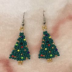 Christmas Tree Seed Beaded Handcrafted Fashion Pierced Earrings. Nwt Dangle Style Measure 2” Long By .75” Wide. With Surgical Steel French Wires. Lightweight, So Delicate Snd Pretty! Unbranded. Christmas Dangle Beaded Earrings With Ear Wire, Christmas Beaded Dangle Earrings With Ear Wire, Christmas Dangle Beaded Earrings With Colorful Beads, Christmas Beaded Round Earrings, Christmas Colorful Beaded Dangle Earrings, Green Beaded Earrings With Dangling Beads For Celebrations, Green Beaded Dangling Earrings For Celebration, Green Dangling Beads Earrings For Celebration, Handmade Beaded Earrings For Christmas Holiday