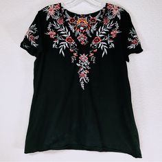 Nwot Johnny Was Black Tayshia Pleat Front V-Neck Floral Embroidery T-Shirt. Rolled Hems With Slightly Flared Waist Hem. Size: Small Pit To Pit: 19” Waist Hem: 22” Length: 25” Arm Hole: 6.5” Spring Embroidered V-neck T-shirt, Casual V-neck Embroidered Top With Multicolor Embroidery, Cotton V-neck T-shirt With Floral Embroidery, Black V-neck Tops With Floral Embroidery, Black V-neck Blouse With Floral Embroidery, Casual V-neck Top With Multicolor Embroidery, Multicolor Floral Embroidered V-neck Top, Spring Crew Neck Top With Embroidered Neckline, Spring Embroidered Neckline Crew Neck Top