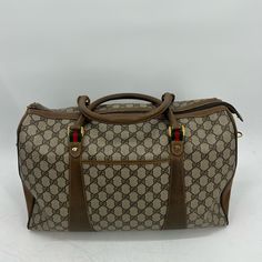 Gucci Sherryline Travel Bag Classic Gucci Monogram With Red And Green Stripped Details And Gold Hardware Approx 16x4x9.5” Has Two Top Handles And Long Shoulder / Crossbody Strap That Can Be Removed And Adjusted Date Code:40-02-073 One Interior Pocket One Exterior Pocket Functional Zippers Item Shows Signs Of Wear From Normal Use- Peeling On Interior, Wear On Leather Piping And Corners, Scratches And Scuffs Throughout, Tarnished&Scratched Hardware , Wear On Long Strap Etc Please Refer To Photos For Further Details Zarjp85308 Pre-owned Gucci Shoulder Bag For Travel, Pre-owned Classic Gucci Bags, Pre-owned Designer Brown Bags, Luxury Pre-owned Brown Bag, Pre-owned Gucci Leather Bag, Pre-owned Designer Rectangular Bag, Designer Brown Travel Bag With Top Handle, Designer Brown Top Handle Travel Bag, Pre-owned Rectangular Business Bags