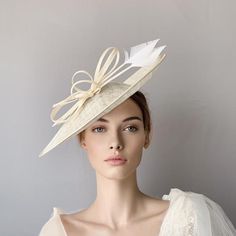 Cream sinamay derby fascinator, Ivory fascinator hat, bow feathers derby hat, Beige wedding hat, Royal ascot hat, women racing hat, saucer This cream sinamay fascinate hat is embellished with a big bow and two arrow feathers.It is a perfect hat for weddings, Royal Ascot horse races, cocktails, derby...It is mounted on a headband.If you want, you can choose the side of the head were you like to wear the fascinator, just convo me.Any color of the fascinator can be changed to order. Chic Summer Fascinator With Feathers, Sinamay Hat Fascinator For Royal Ascot, Summer Wedding Fascinator With Feathers, Chic Wedding Mini Hat With Feathers, Chic Mini Hats With Feathers For Wedding, White Sinamay Fascinator For Races, White Sinamay Fascinator For Royal Ascot, White Sinamay Fascinator For Wedding, Wide Brim Feathered Fascinator