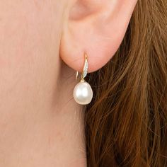 Guaranteed to add a touch of sparkle to any look, our natural diamond and Keshi pearl drop earrings are crafted from the finest 9ct yellow gold. Our baroque Keshi pearls are unique in shape and colour so every single earring will be different! These dainty gold drop earrings feature a classic hook fastening and are suitable for almost any age. A lovely Christmas gift, stocking filler or for a birthday treat for anyone born in April or June. A wonderfully thoughtful way to mark a milestone birthd Gold Drop Pearl Earrings With Diamond Accents, Yellow Gold Teardrop Pearl Earrings With Elegant Design, Pear-shaped Diamond Jewelry With Pearl Drop, Pear Shaped Diamond Jewelry With Pearl Drop, Pear-shaped Pearl Charm Earrings In Fine Jewelry Style, Fine Jewelry Diamond Drop Earrings With Pearl, Yellow Gold Diamond Earrings With Pearl Drop As Gift, Pear-shaped Diamond Pearl Earrings For Gifts, Elegant Gold Pear-shaped Pearl Earrings