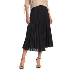 An On-Trend Midi Length Skirt Features A Chic Pleated Construction And Flowy Look. Excellent New Condition No Visible Flaws Or Signs Of Wear 34" Length (Size S) Elasticized Waist Pull-On Style Pleated Construction Partially Lined 100% Polyester With 65% Polyester, 35% Rayon Lining Dry Clean Imported Model Stats: 5'10" Height, 32" Bust, 25" Waist, 36" Hip. Model Is Wearing Size S. Item #6309659 Black Pleated Hem Skirted Bottoms, Black Pleated Skirt With Pleated Hem For Spring, Black Skirted Bottoms With Pleated Hem, Black Pleated Hem Flared Skirt, Spring Black Pleated Skirt Bottoms, Black Pleated Flared Skirt, Black Skirt With Pleated Hem For Work, Black Pleated Hem Skirt For Summer, Summer Black Pleated Hem Skirt