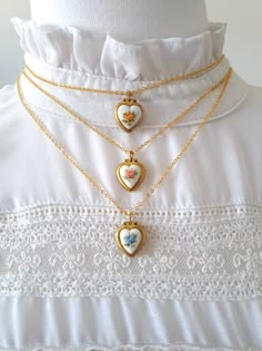 "♥️ Lovely unused 50s vintage tiny heart lockets with Japanese ceramic hearts in a dainty gold plated chain choker measuring 16\" = 40cm or 20\" = 50cm. This small vintage lockets measure 15mm x 14mm and allow adding a picture inside one of the lids. These are very old tiny lockets available in blue, red or yellow flowers. They are made of brass, and most of them have patina or little stains due to the passage of time. This enhances their vintage condition and shows their real age. These are tru Cheap Sentimental Valentine's Day Necklaces, Cheap Heart Charm Locket Necklace For Gift, Cheap Heart Pendant Charm Necklace For Gift, Cheap Heart Charm Necklace For Romantic Gift, Affordable Open Heart Charm Necklace For Valentine's Day, Pretty Necklaces Sentimental, Cheap Heart Necklace For Romantic Gift, Cheap Sentimental Locket Jewelry, Cheap Valentine's Day Locket Necklace