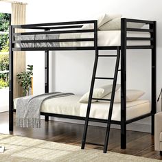 a black bunk bed with white sheets and pillows on top of it in a room