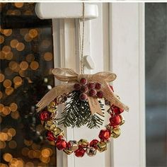 a christmas wreath hanging on the front door