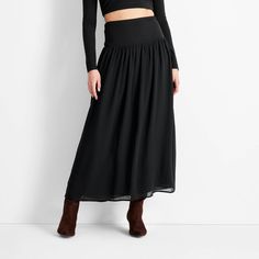 This High-Rise Drop Waist Maxi Skirt from Future Collective™ is a great alternative to the LBD. Made with rayon fabric with added spandex, this maxi skirt has a drop-waist gathered design for a touch of sophistication and flow. Featuring a high-rise silhouette and full elastic waistband, this skirt lets you step out in comfort and on-trend style. Future Collective™: Inspired by what’s now to inform what’s next. Versatile Relaxed Fit Gathered Maxi Skirt, Flowy Tiered Skirt With Gathered Waist, High Waist Flowy Skirt With Wide Waistband, Versatile Relaxed Maxi Skirt With Lined Detail, Versatile Relaxed Maxi Skirt With Lining, Versatile Relaxed Fit Lined Maxi Skirt, Versatile Flowy Lined Maxi Skirt, Flowy Tiered Skirt With Lining, Black Ruched Long Skirt