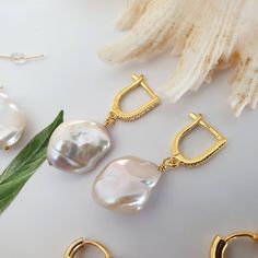 Keshi pearl earrings, Baroque earrings, huggie hoop earrings, Bridesmaid gift, Real pearl earrings, pearl drop earrings, freshwater pearl earrings, cubic zirconia hoops, modern earrings, pearl hoop earrings, baroque pearl hoops, Gift for her, bridesmaid gift ideas. A pair of unique pearl earrings for brides, bridesmaids..Irregular shapes gives classic pearls a more modern update. Pearls have evolved into one of the most popular trends that started in 2020 and they're going to maintain their plac Hoop Pearl Pendant Earrings As Gift, Delicate Huggie Pearl Earrings, Pearl White Hoop Earrings For Gift, Pearl White Hoop Pearl Earrings As Gift, Elegant Pearl Huggie Earrings For Gifts, Pearl Charm Pear-shaped Earrings For Gift, Hoop Pearl Drop Earrings As Gift, Pear-shaped Pearl Charm Earrings For Gift, Gift Pearl Drop Huggie Hoop Earrings