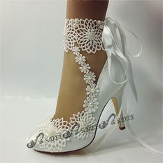 The small pearls are hand sewn on the lace! Heel size: 10cm/4 inches (include platform) Model Shoes are size 36, larger sizes may have different appearance SIZE COVERSION （Only for reference） US 5-5.5UK 3-3.5EURO 35 Length(mm) 228.8 US 5.5-6UK 3.5-4EURO36 Length(mm) 235.4 US 6.5-7UK 4.5-5EURO 37Length(mm)242 US 7.5-8UK 5.5-6EURO 38Length(mm)248.6 US 8.5UK6.5EURO39 Length(mm)255.2 US 9UK 7EURO 40Length(mm)261.8 US 9.5-10UK 7.5-8EURO 41 Length(mm)268.4 US 10.5-11UK 8.5-9EURO 42Length(mm)275 Shoes Lace Ankle Strap Wedding Shoes, White Lace Ankle Strap Wedding Shoes, White Lace Wedding Shoes With Ankle Strap, Elegant Pearl Embroidered Lace For Wedding, Lace Bridal Accessories For Ceremony, Elegant Wedding Lace With Pearl Embroidery, White High Heel Wedding Shoes With Lace Trim, White Lace High Heel Wedding Shoes, White Lace Trim Closed Toe Wedding Shoes