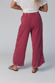 Comfy and cozy all in one! Our lounge pant features a wide leg, drawstring waist and pockets (yay!). It will be your closet fave to pair with graphic tees for lounging or on-the-go outfits! *Due to lighting and differences in monitors, actual colors may vary slightly from what appears online. Model is 5'8" and wearing size Small Approximate measurements are as follows: SMALL: Waist: 26", Inseam: 26 1/2", Length: 34" MEDIUM: Waist: 28", Inseam: 27", Length: 34 1/2" LARGE: Waist: 30", Inseam: 27 1 Comfortable Lounge Bottoms With Drawstring, Comfortable Drawstring Loungewear Bottoms, Comfortable Drawstring Bottoms For Loungewear, Relaxed Fit Drawstring Bottoms For Loungewear, Casual Wide Leg Soft-washed Bottoms, Cotton Pull-on Sweatpants For Lounging, Cotton Lounging Bottoms, Casual Soft-washed Wide Leg Pants, Cozy Relaxed Fit Bottoms With Drawstring